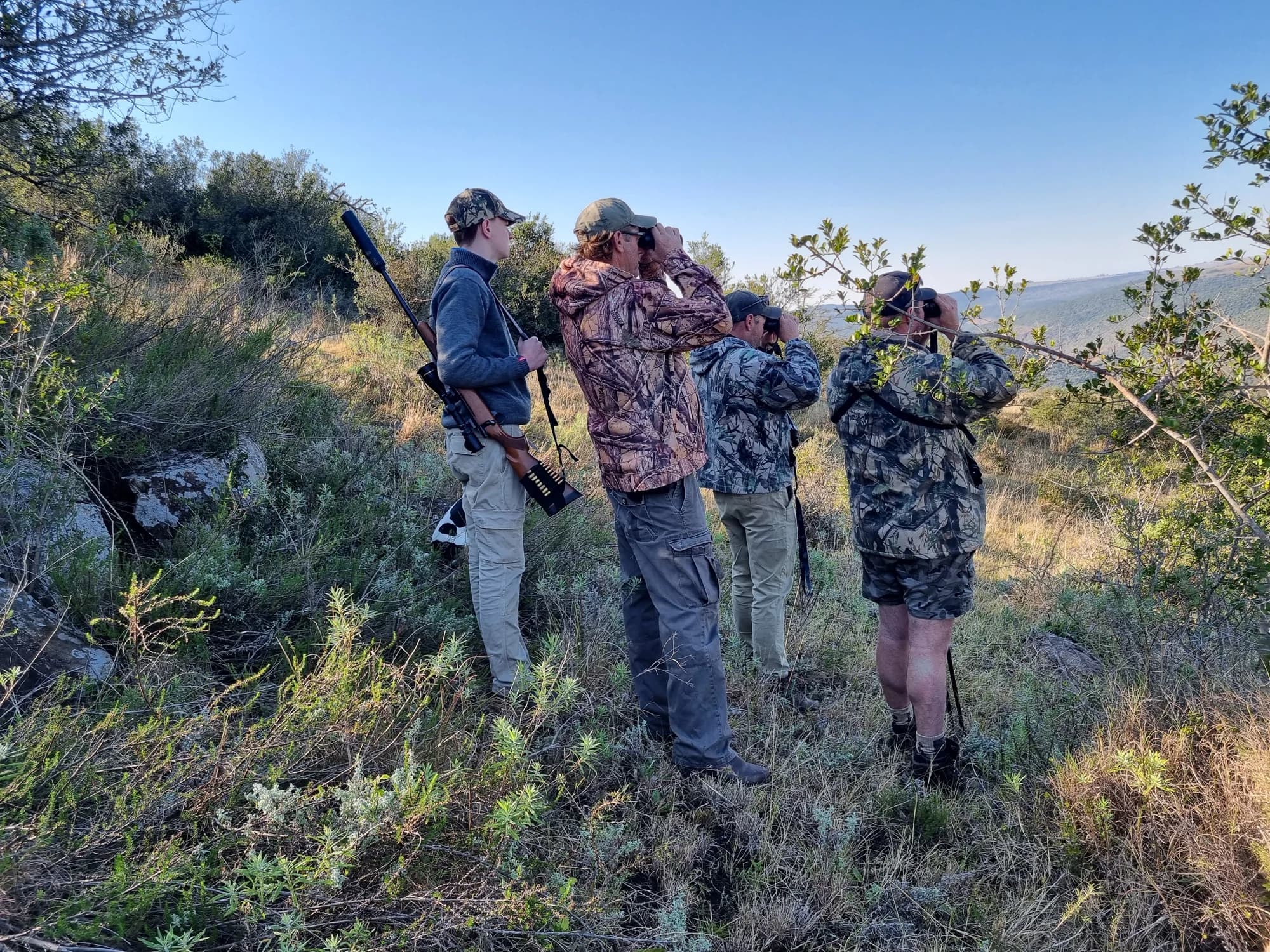 A group observing the bush together on foot