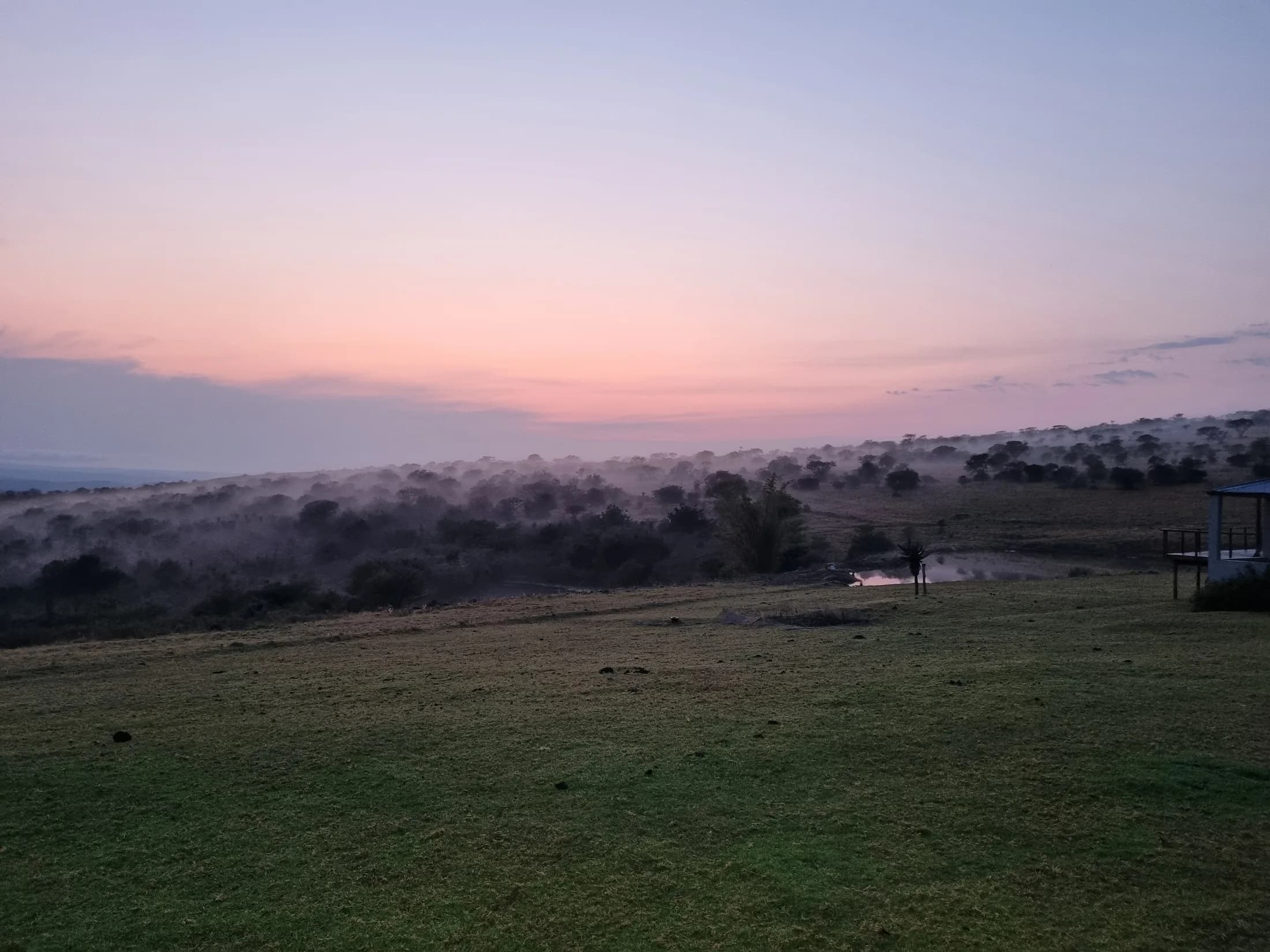 A misty sunrise view across the Garland lodge grounds
